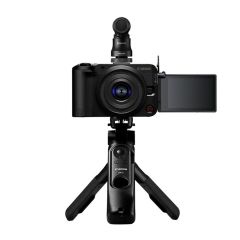 Canon EOS R50 V Creator Kit - front straight on supplied grip with supplied mic attached and screen flipped out