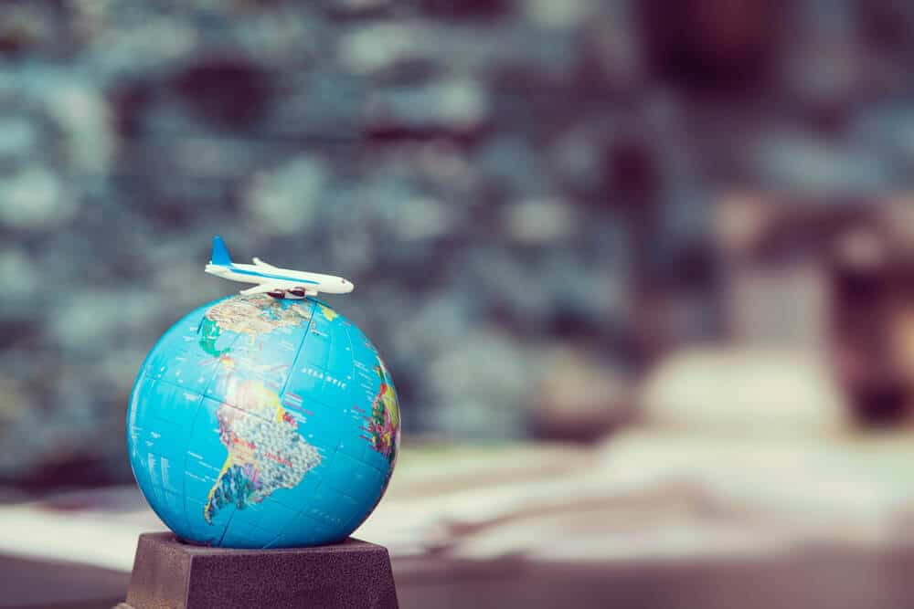 mini aeroplane model on world globe