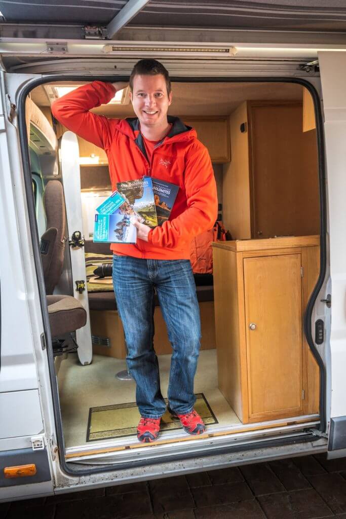 James Rushforth in his van holding his books