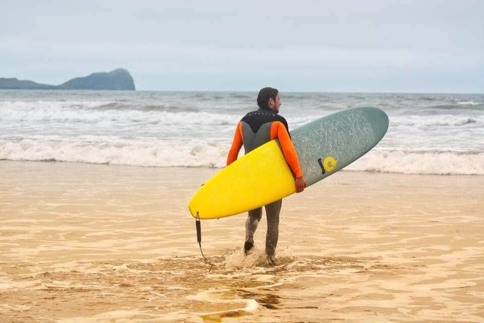 surfer looking out to sea