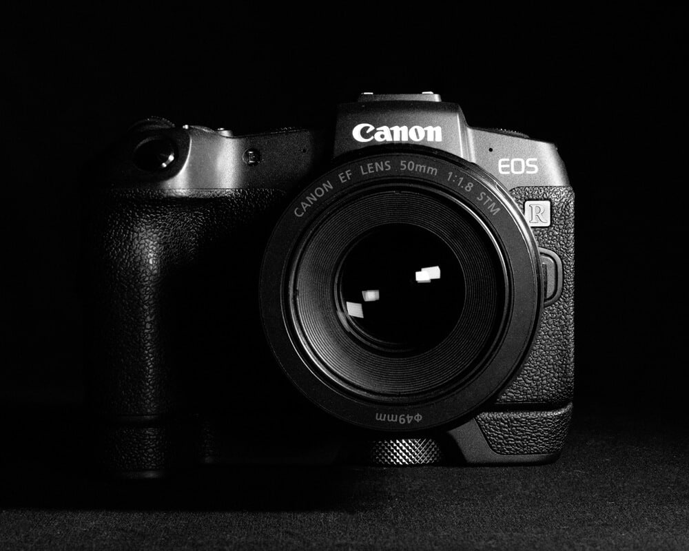 black and white image of Canon EOS R camera